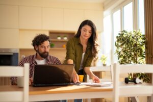 Woman and man looking at computer